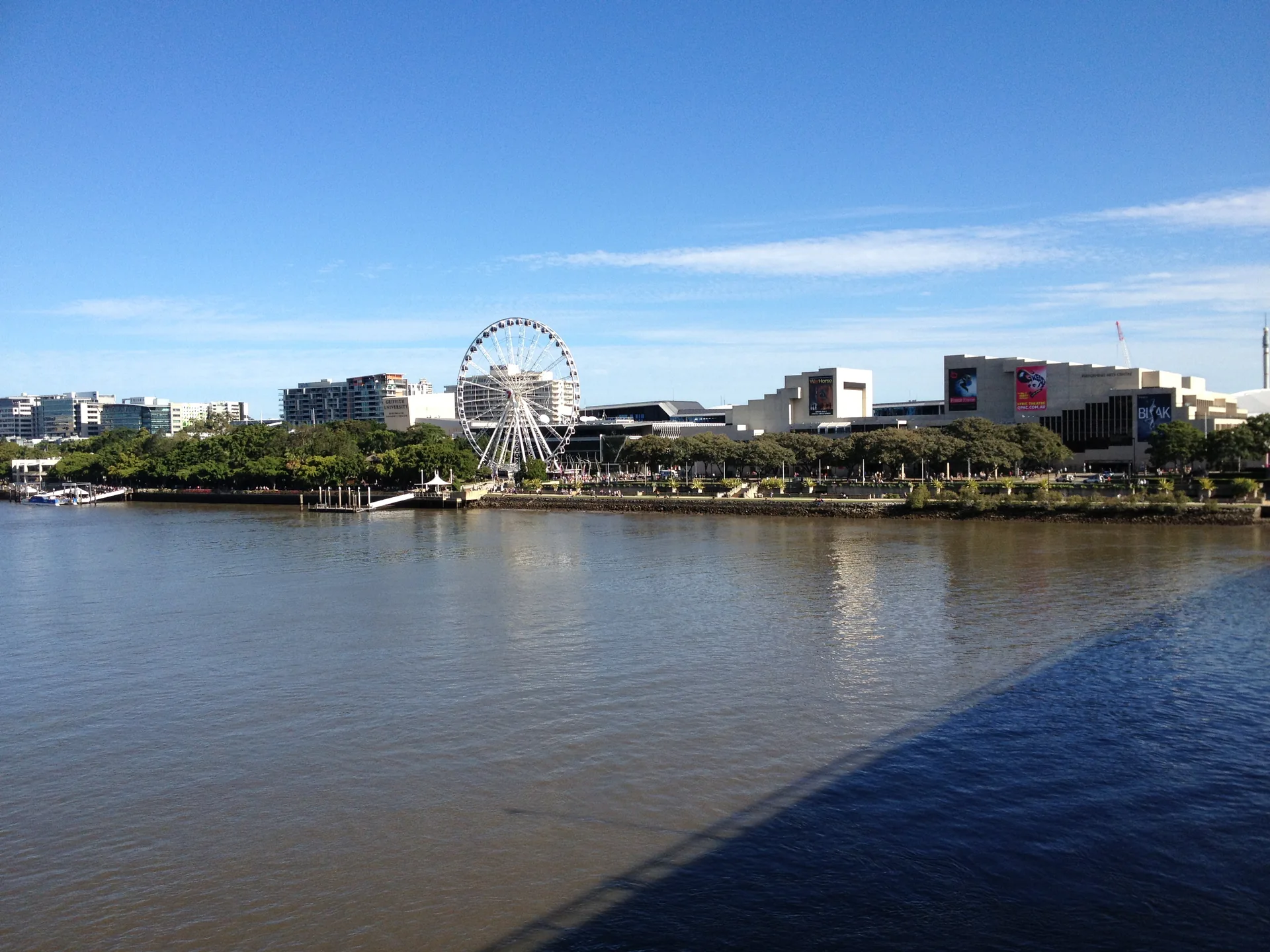 The Wheel of Brisbane and South Bank Parklands seen across the Brisbane River.
