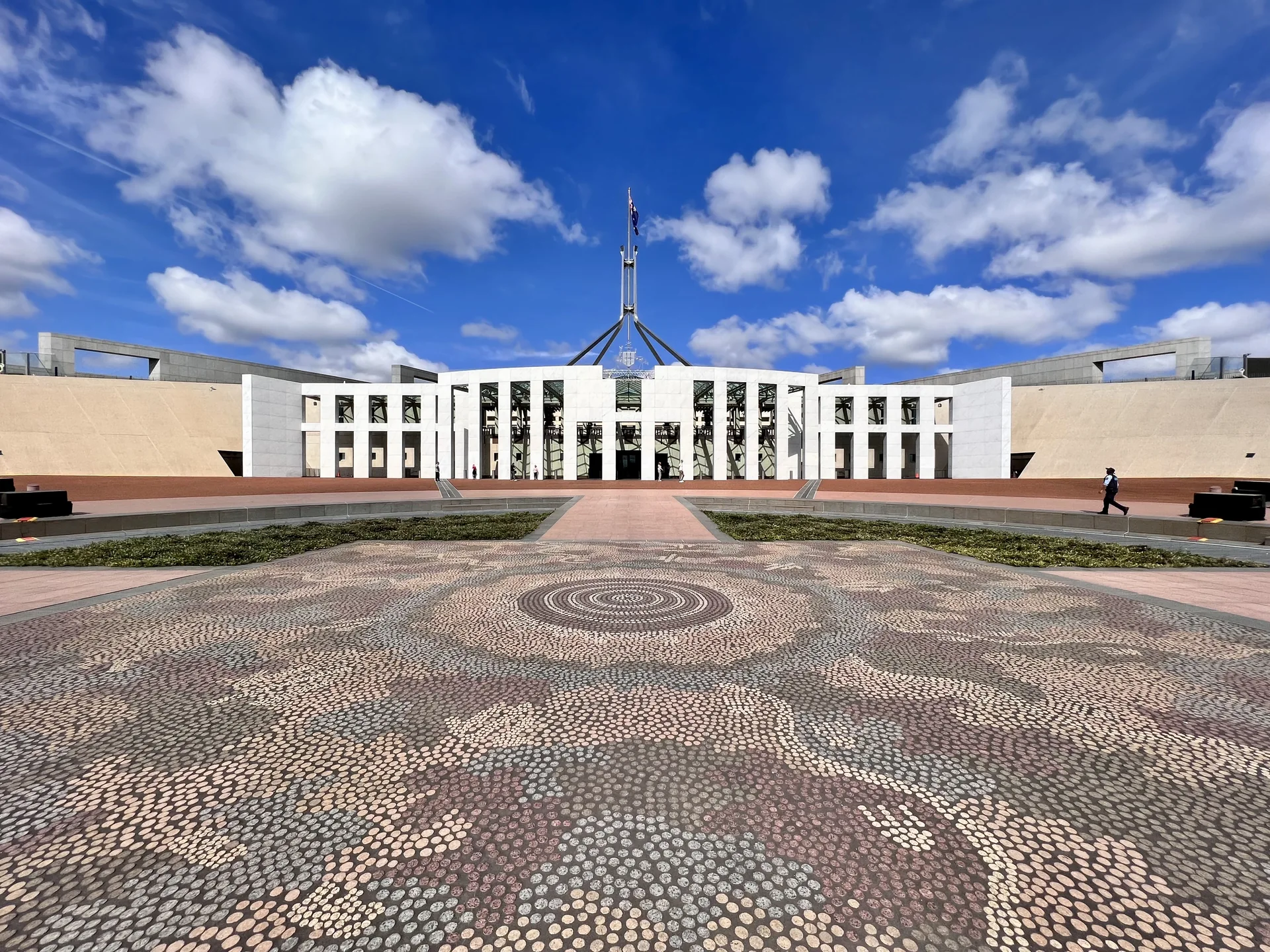 Australia’s Parliament House in Canberra with its central flag mast and ceremonial forecourt.