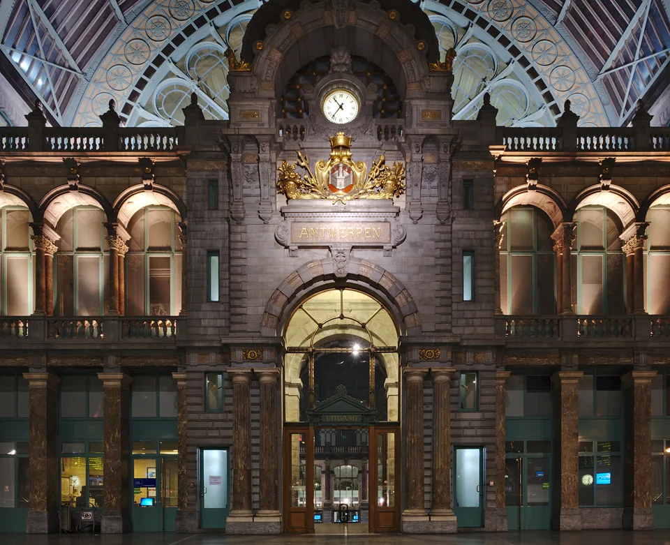 Clock and monumental entrance hall inside Antwerp Central Station