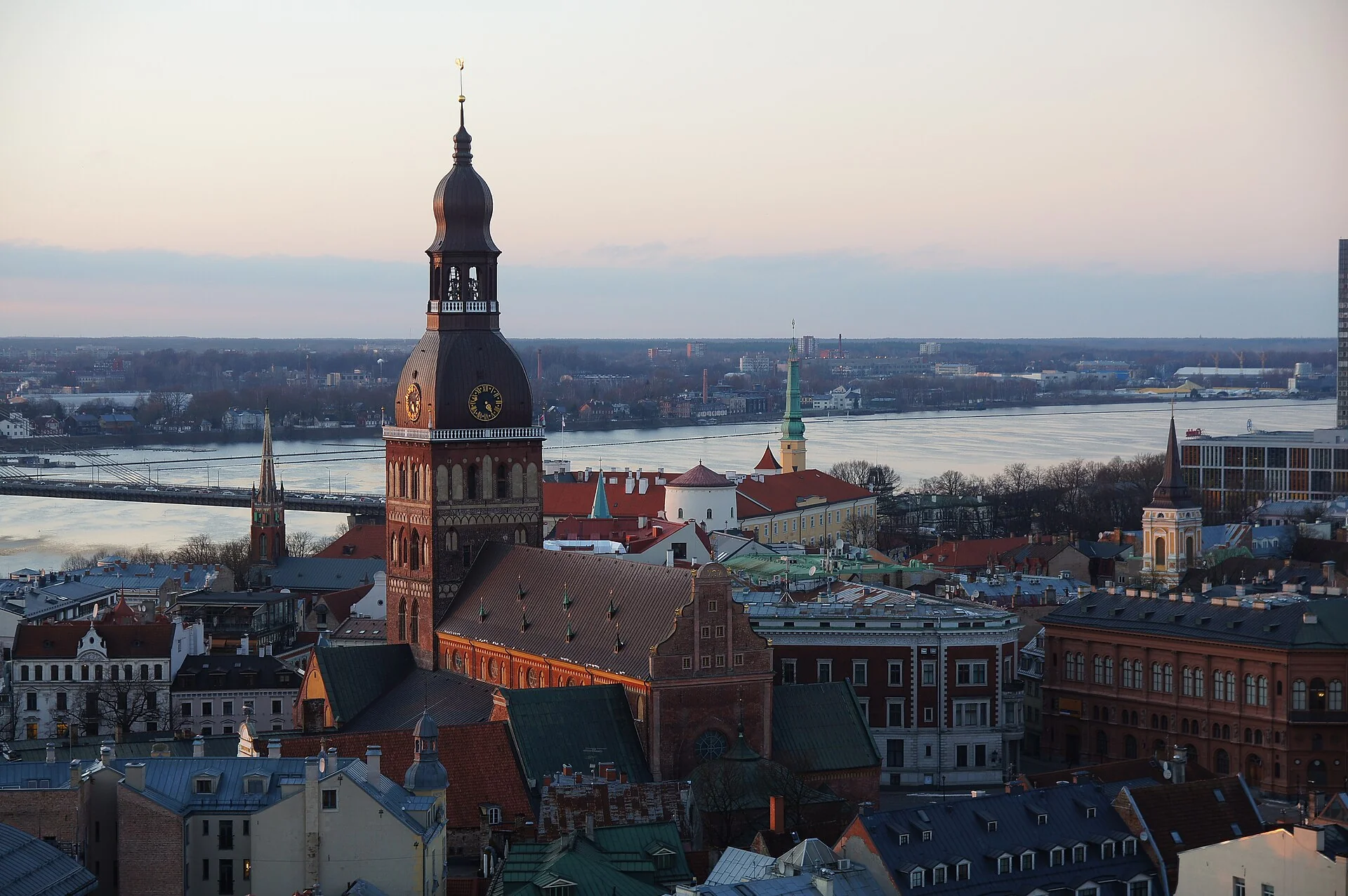 Riga Dome Cathedral rising above Old Town roofs with the Daugava River behind