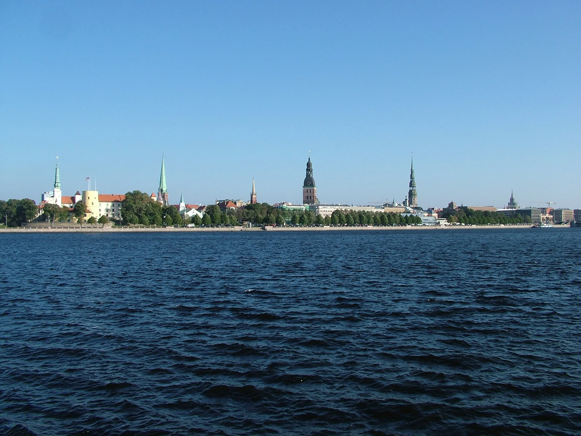 Historic Riga skyline, cathedral spires and Riga Castle seen across the Daugava