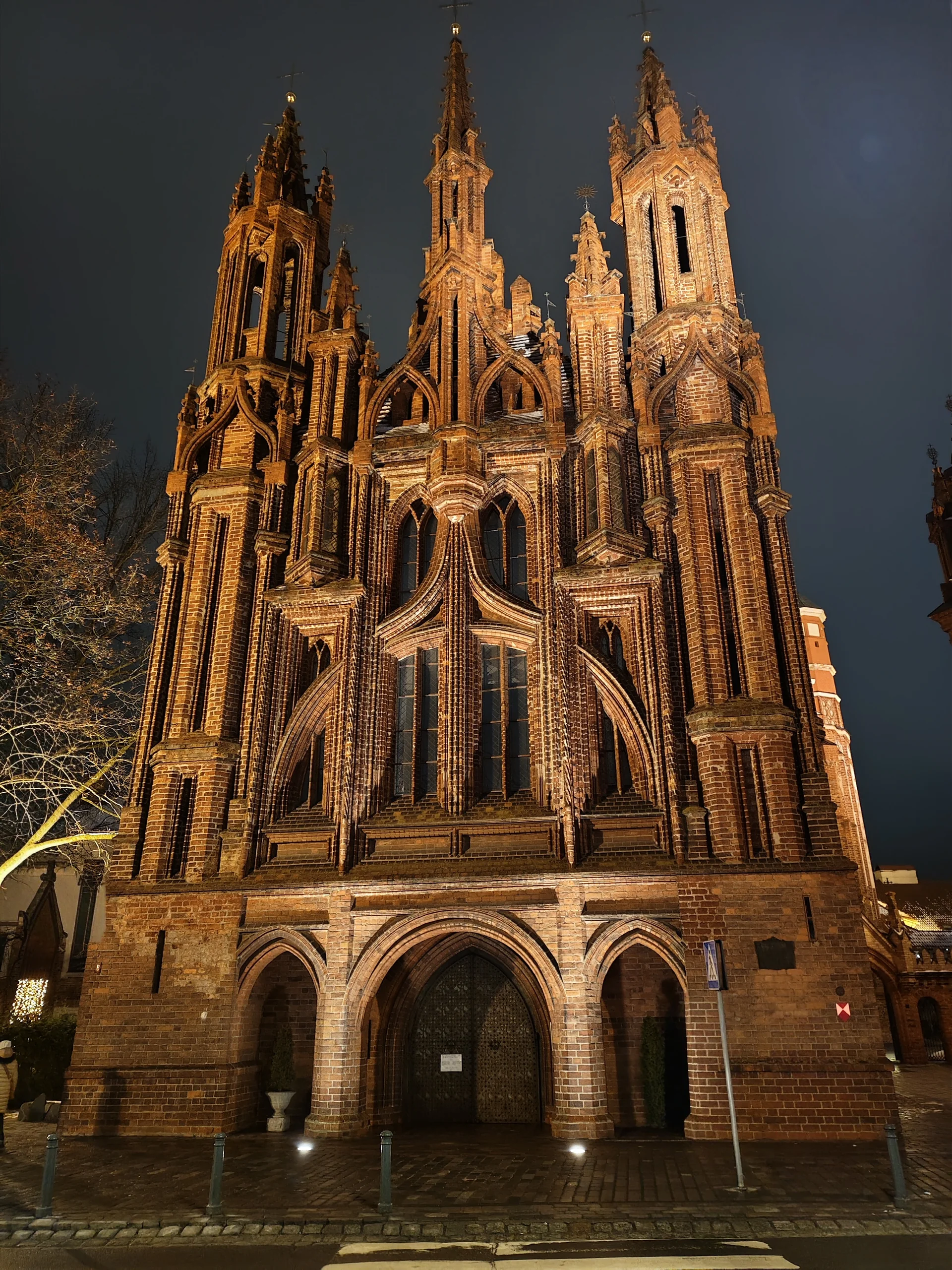 Illuminated brick Gothic façade of St Anne’s Church in Vilnius at night