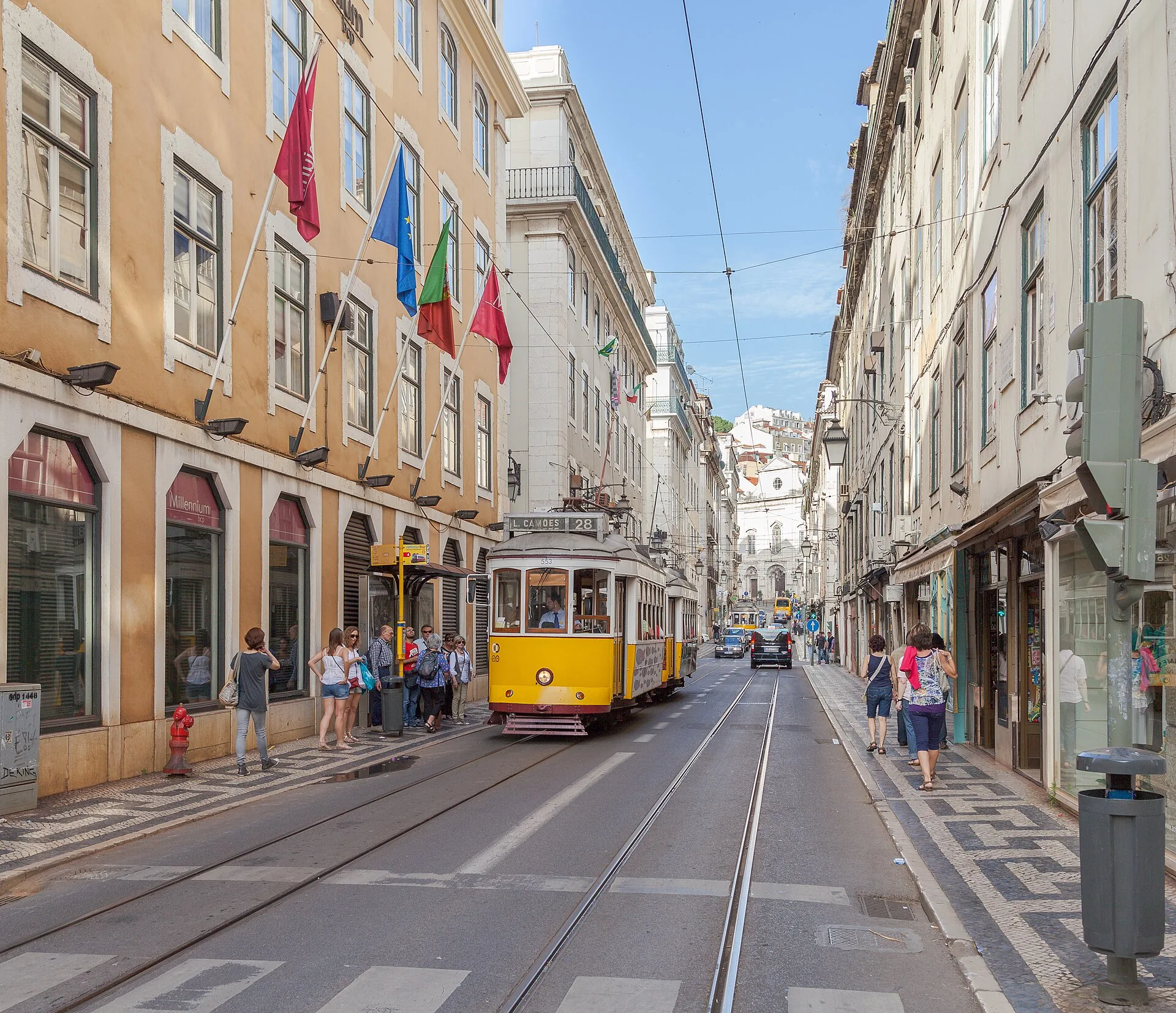 A yellow Lisbon tram on Rua da Conceição