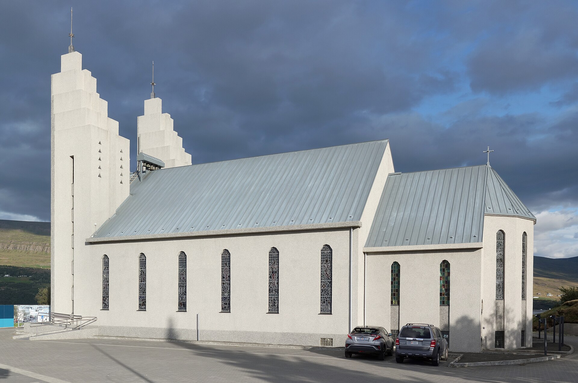 The twin stepped towers and long side facade of Akureyrarkirkja in Akureyri
