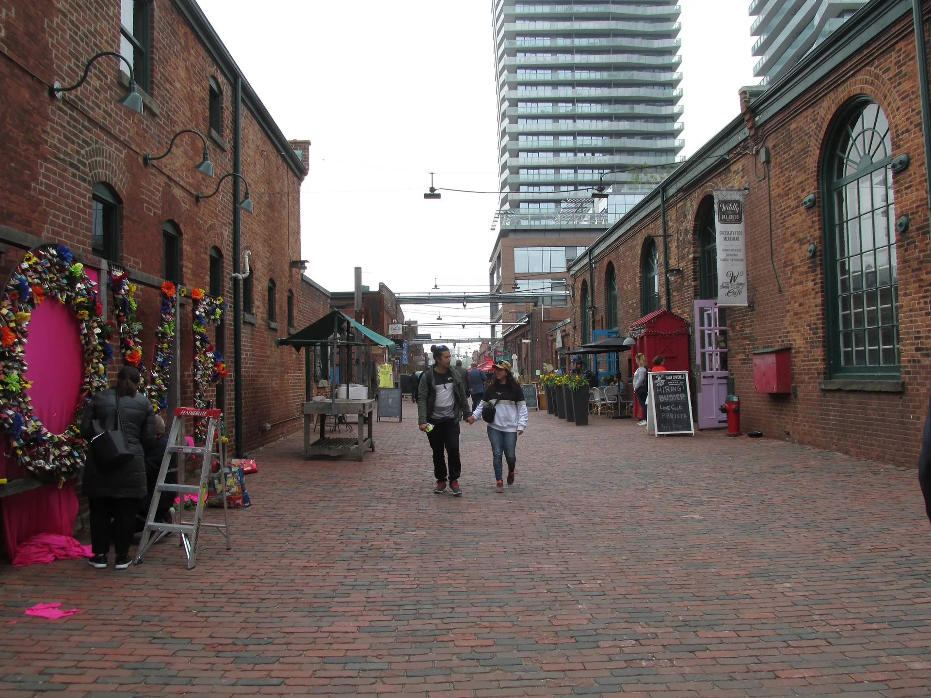 Pedestrians on the brick-paved Tank House Lane in Toronto’s Distillery District