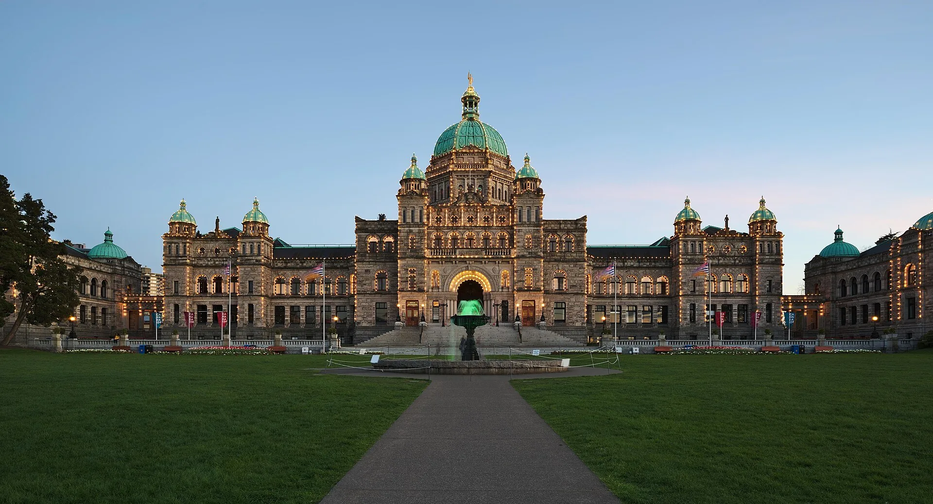 Victoria’s British Columbia Parliament Buildings illuminated against the evening sky