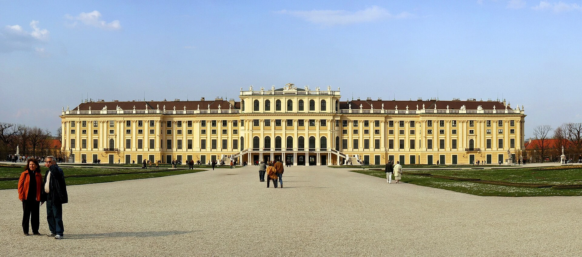 The yellow façade and formal forecourt of Schönbrunn Palace in Vienna