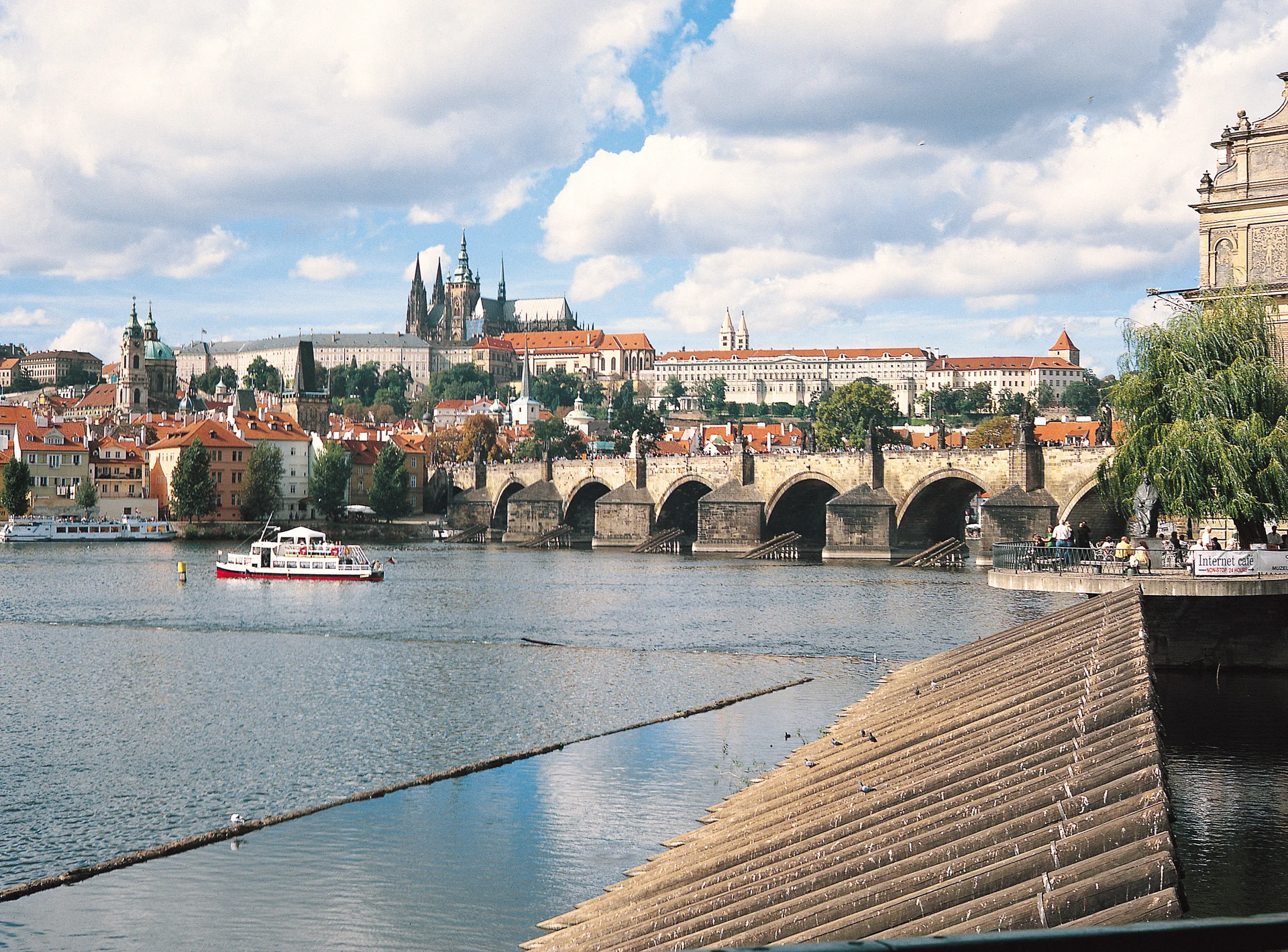 Charles Bridge crosses the Vltava beneath Prague Castle and St Vitus Cathedral in Czechia