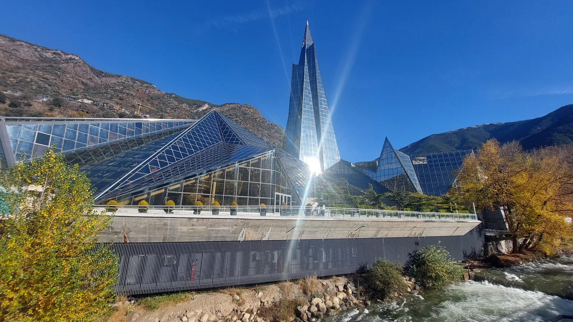Caldea’s pointed glass tower and angular spa buildings beside the river in Escaldes-Engordany