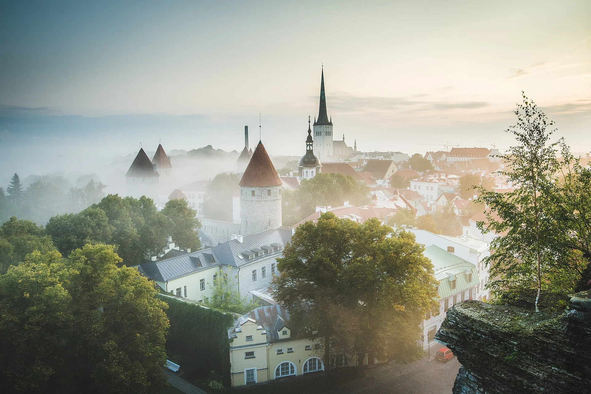 The towers and red roofs of Tallinn’s Old Town at sunrise