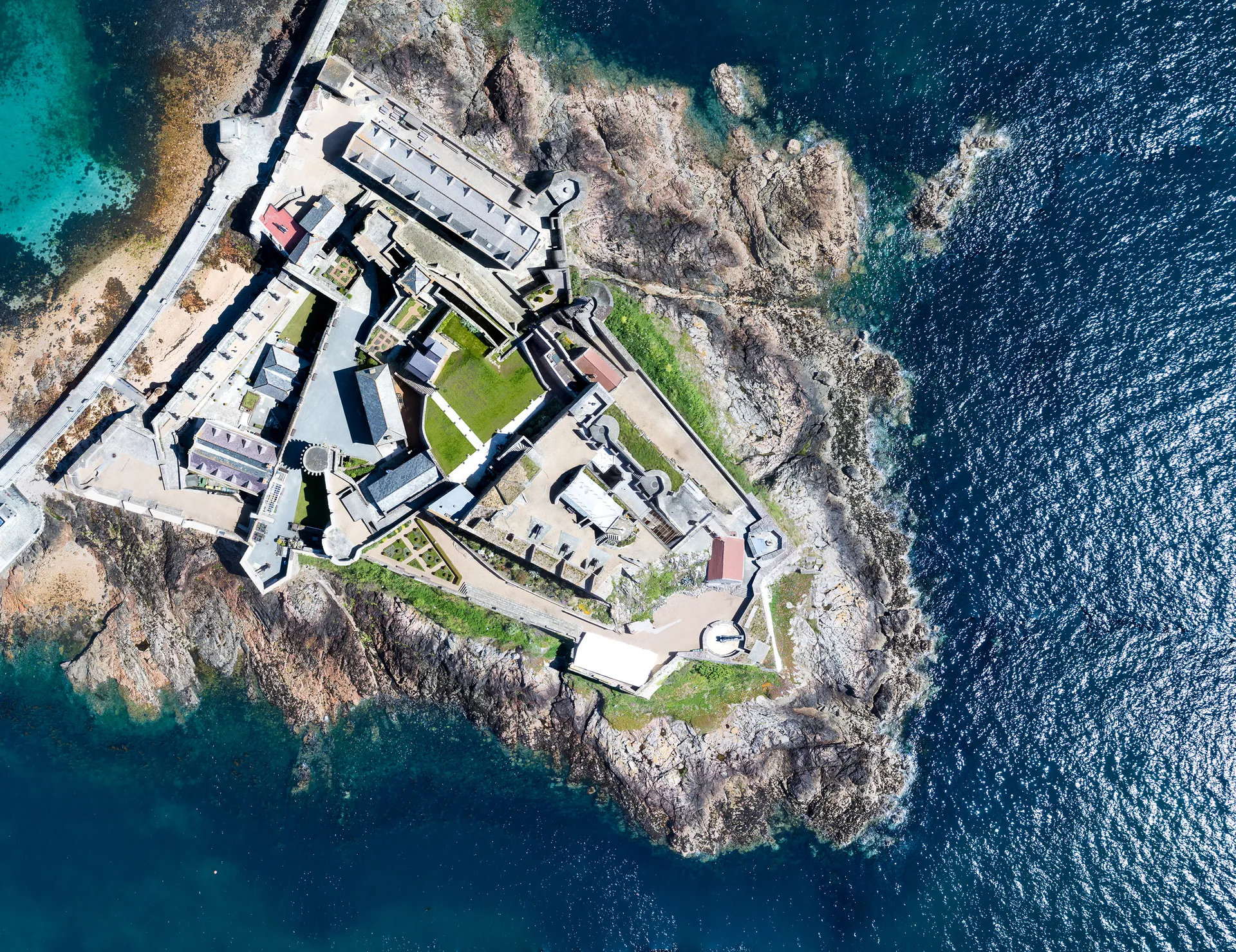 Castle Cornet and its fortifications surrounded by blue water at St Peter Port, Guernsey
