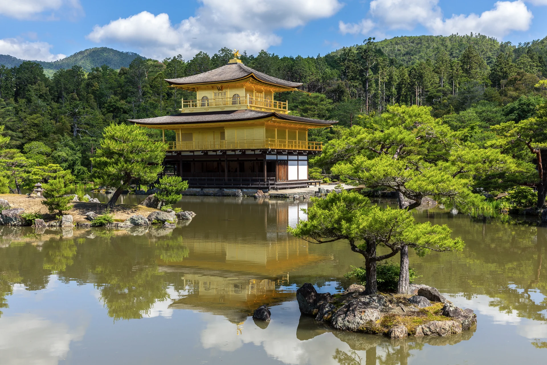 The Golden Pavilion at Kinkaku-ji reflected in its garden pond, Kyoto.