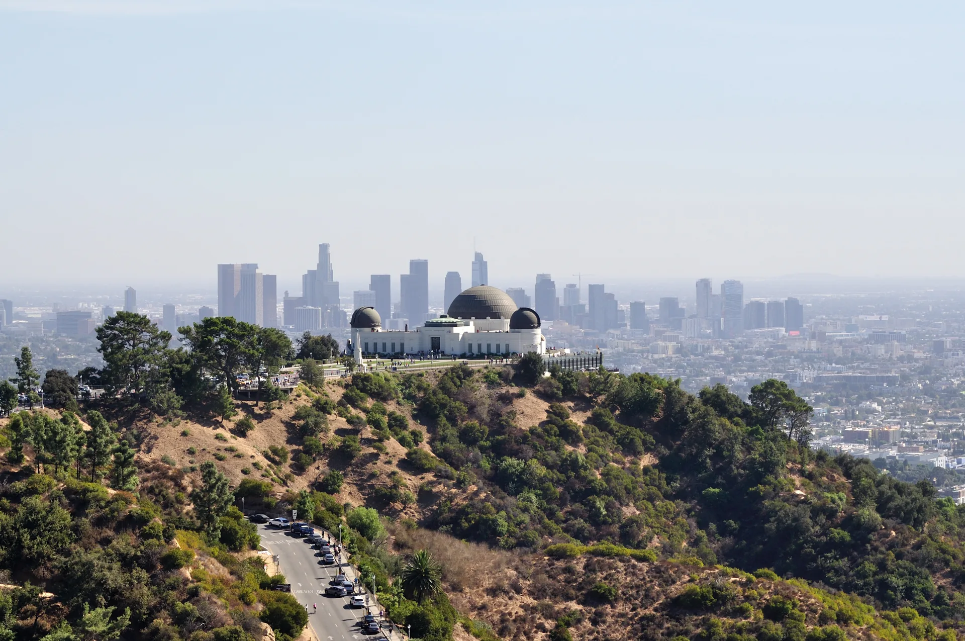 Griffith Observatory above Los Angeles, with the downtown skyline in the distance.