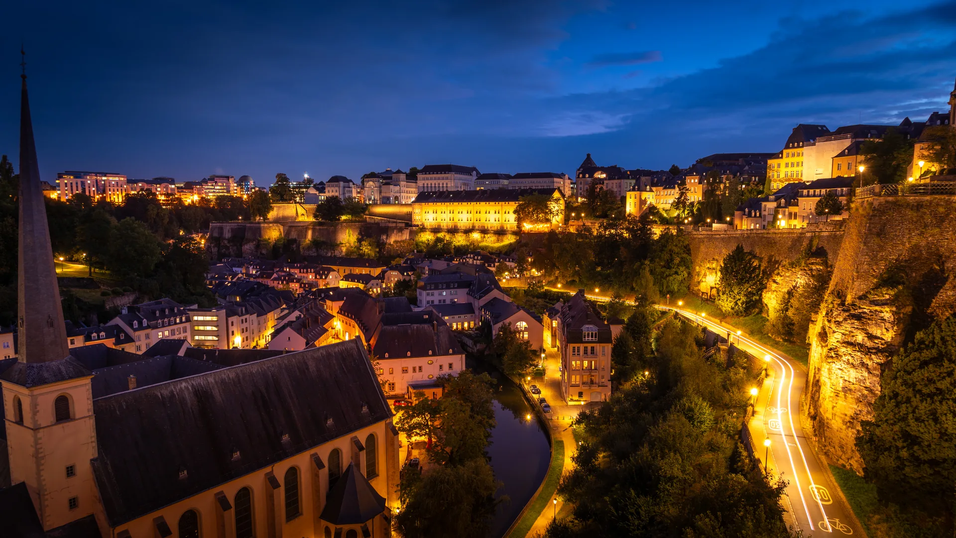 The Grund district and illuminated upper town of Luxembourg City at blue hour
