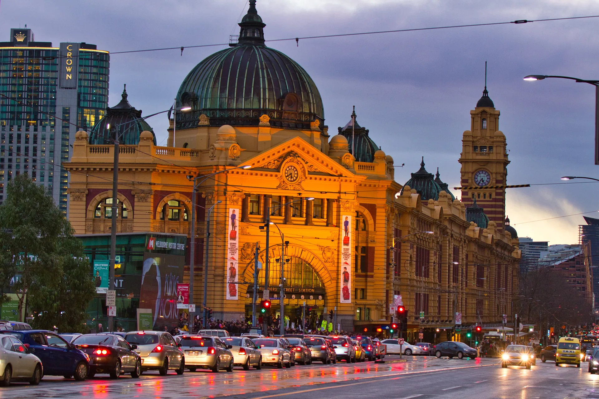 Flinders Street Station in Melbourne, illuminated at dusk.
