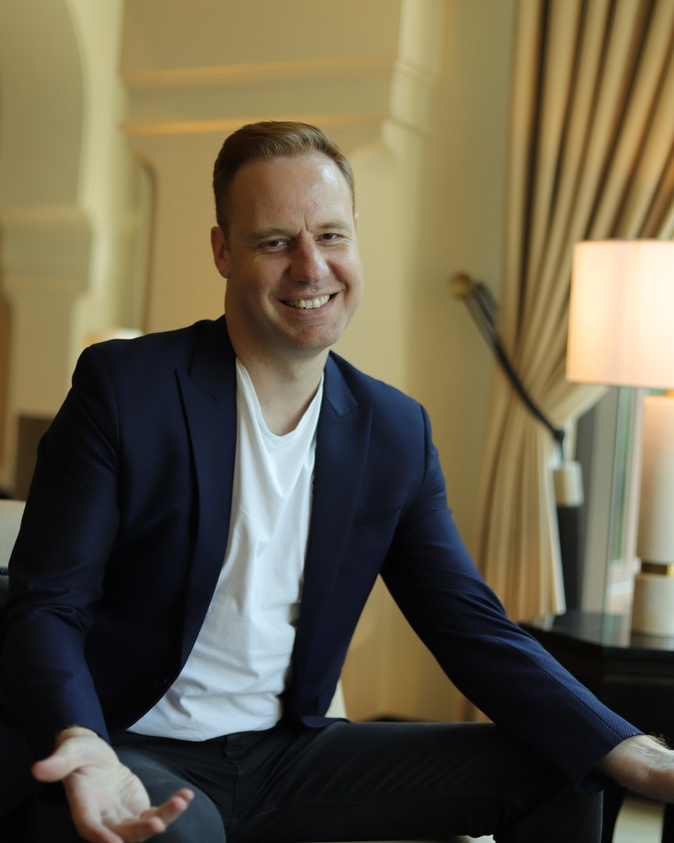 Michael Rosmer smiling in a navy blazer