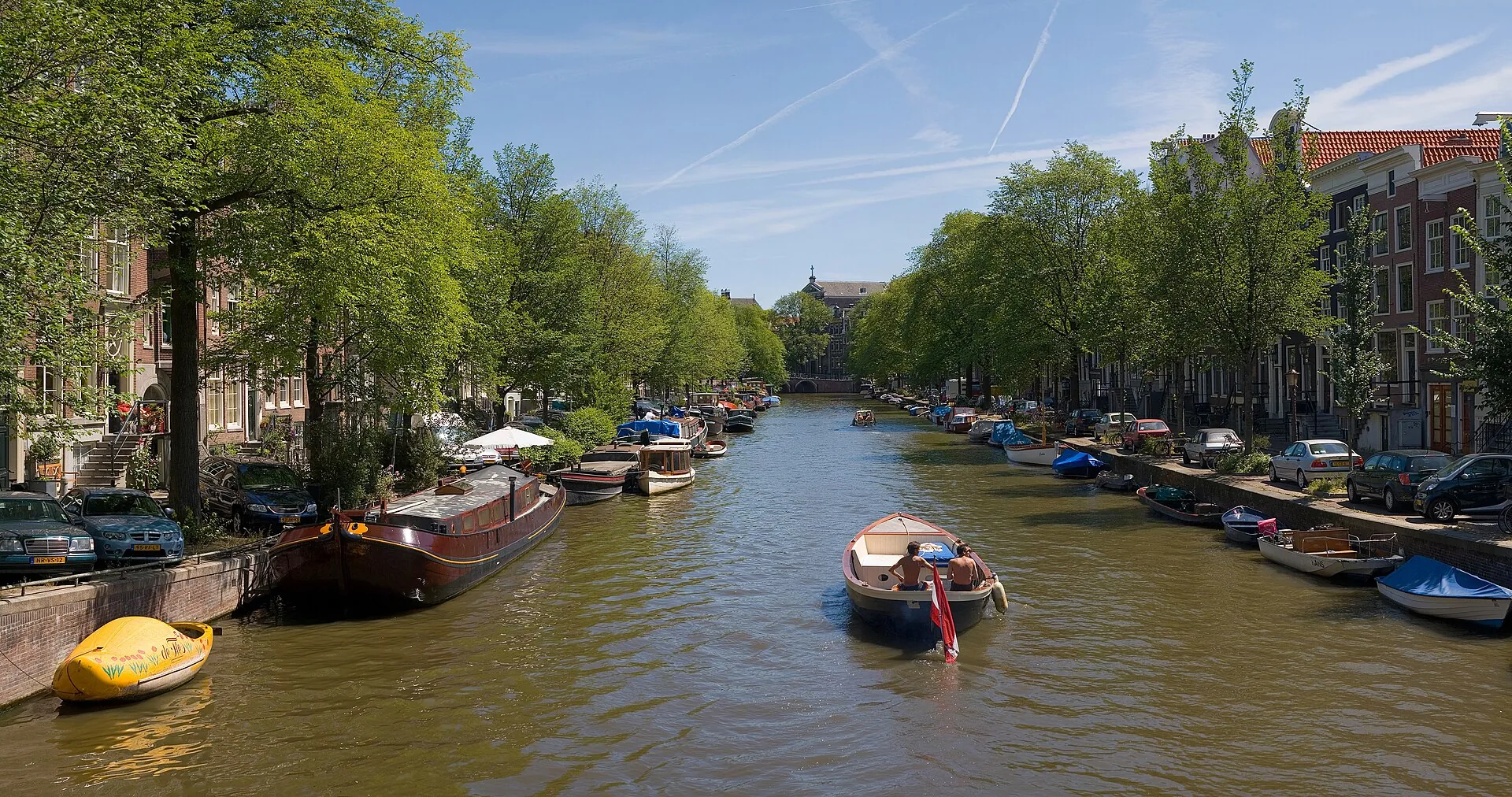 Amsterdam’s canals, arched bridges and historic canal houses in summer