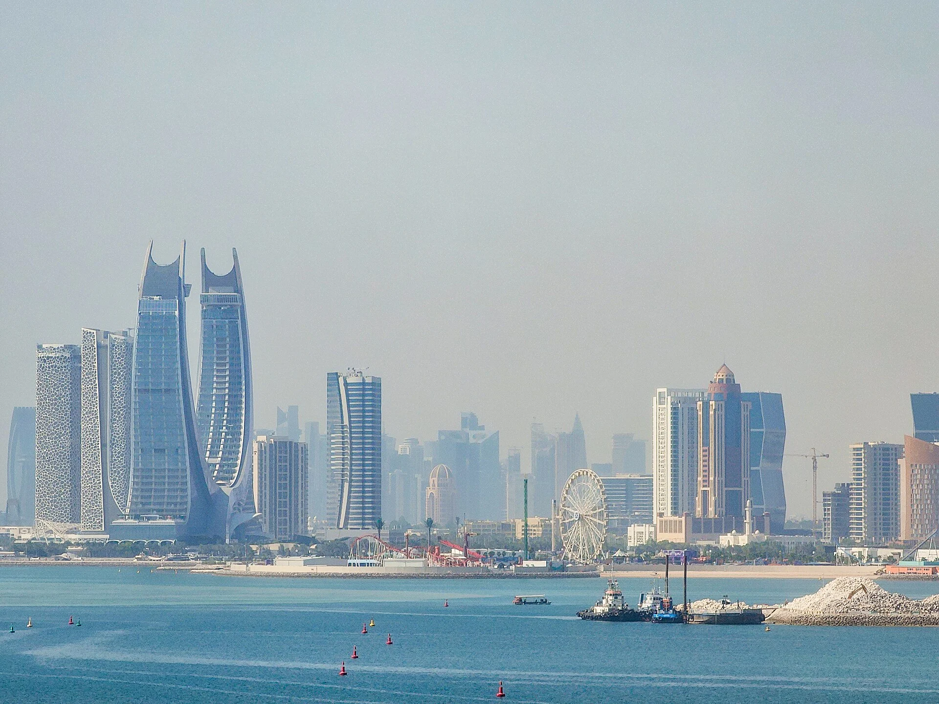 Lusail’s waterfront skyline seen from Qetaifan Island, with the paired curved Katara Towers among the buildings