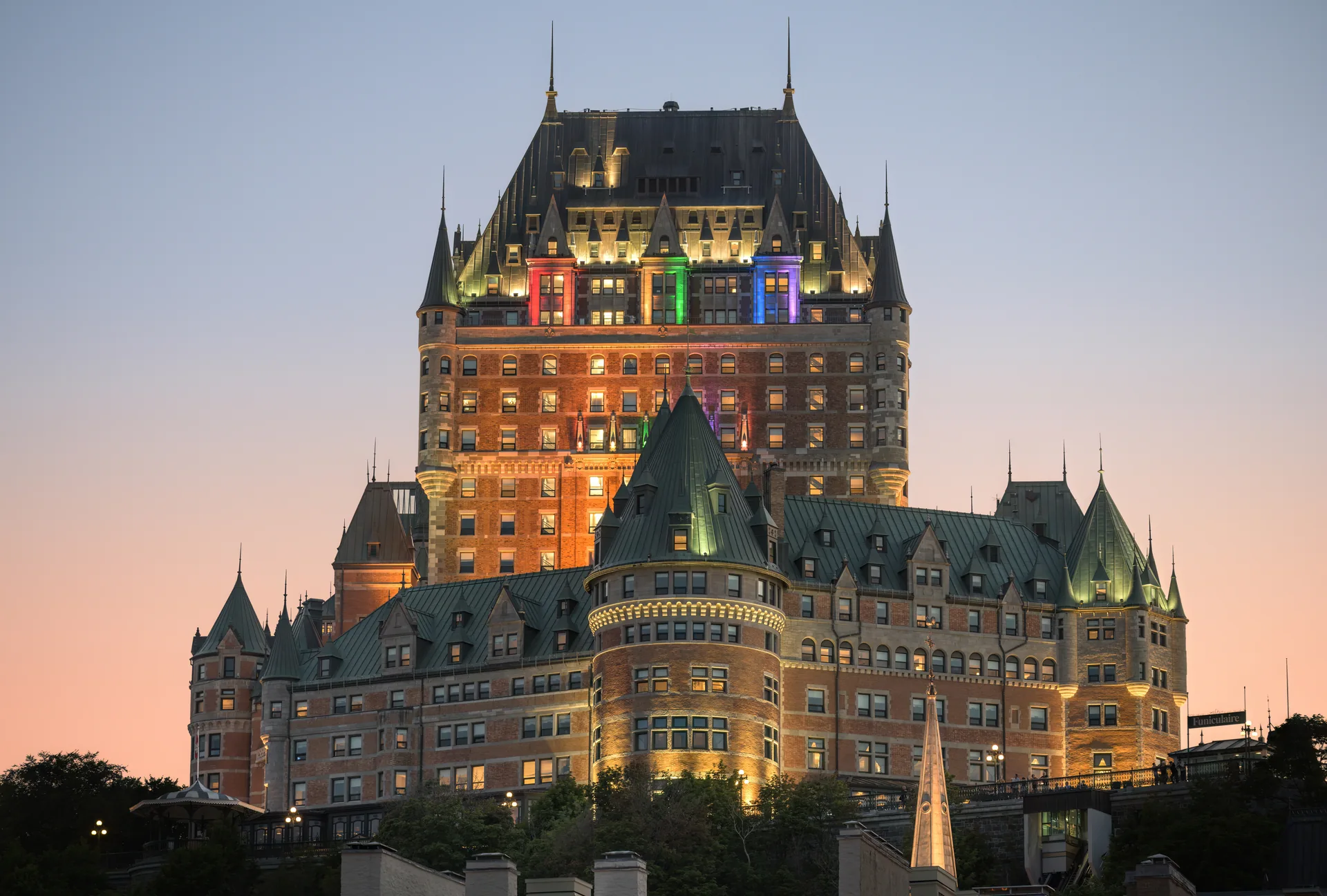 Château Frontenac illuminated at dusk in Québec City.