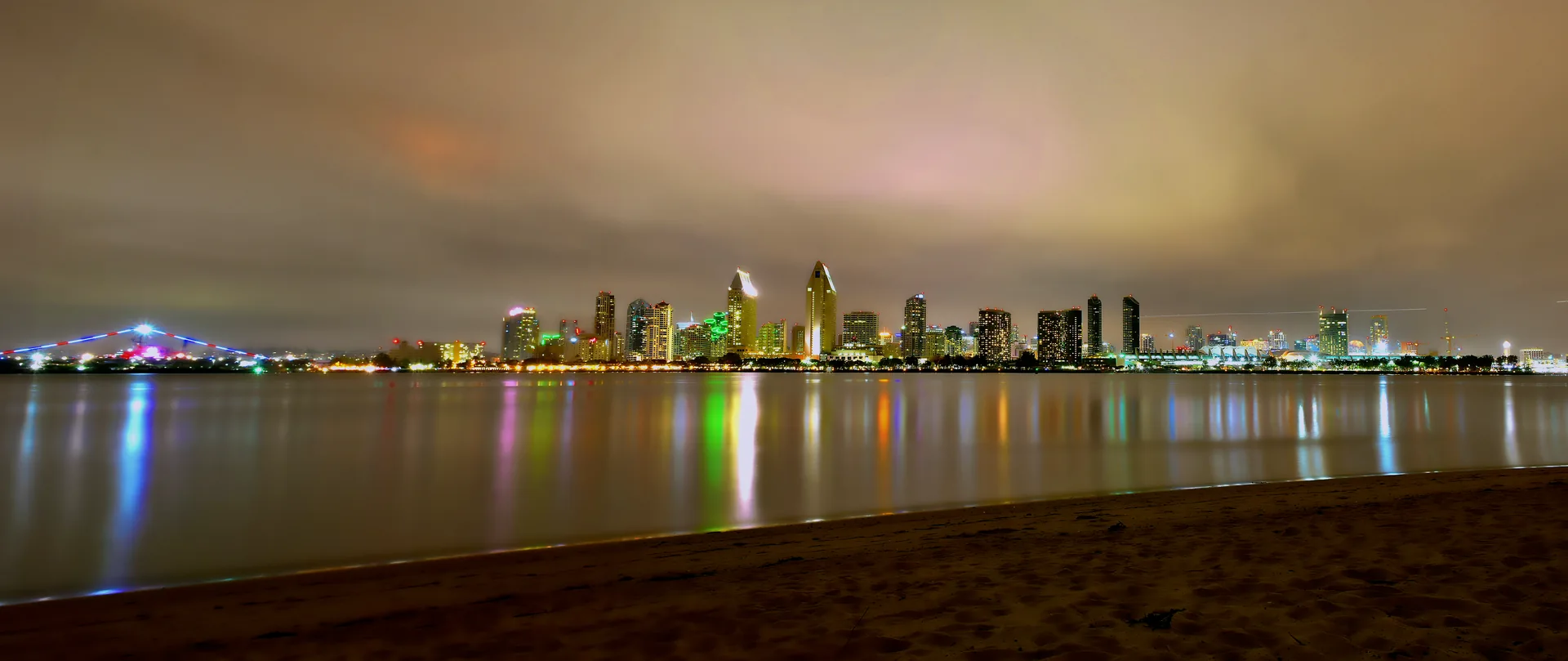 San Diego skyline and its waterfront lights viewed across the bay.