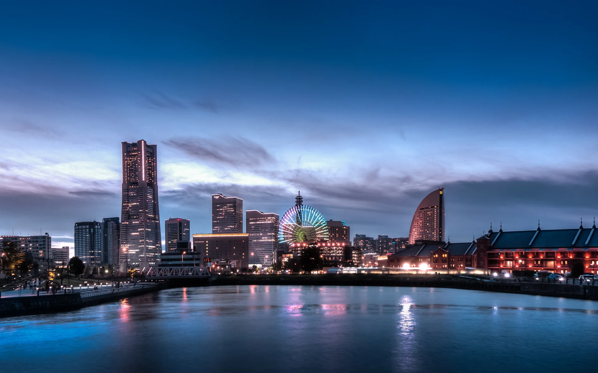 The Minato Mirai skyline, including Landmark Tower, from Yamashita Park at dusk.